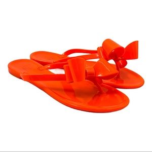 neon orange jelly sandals